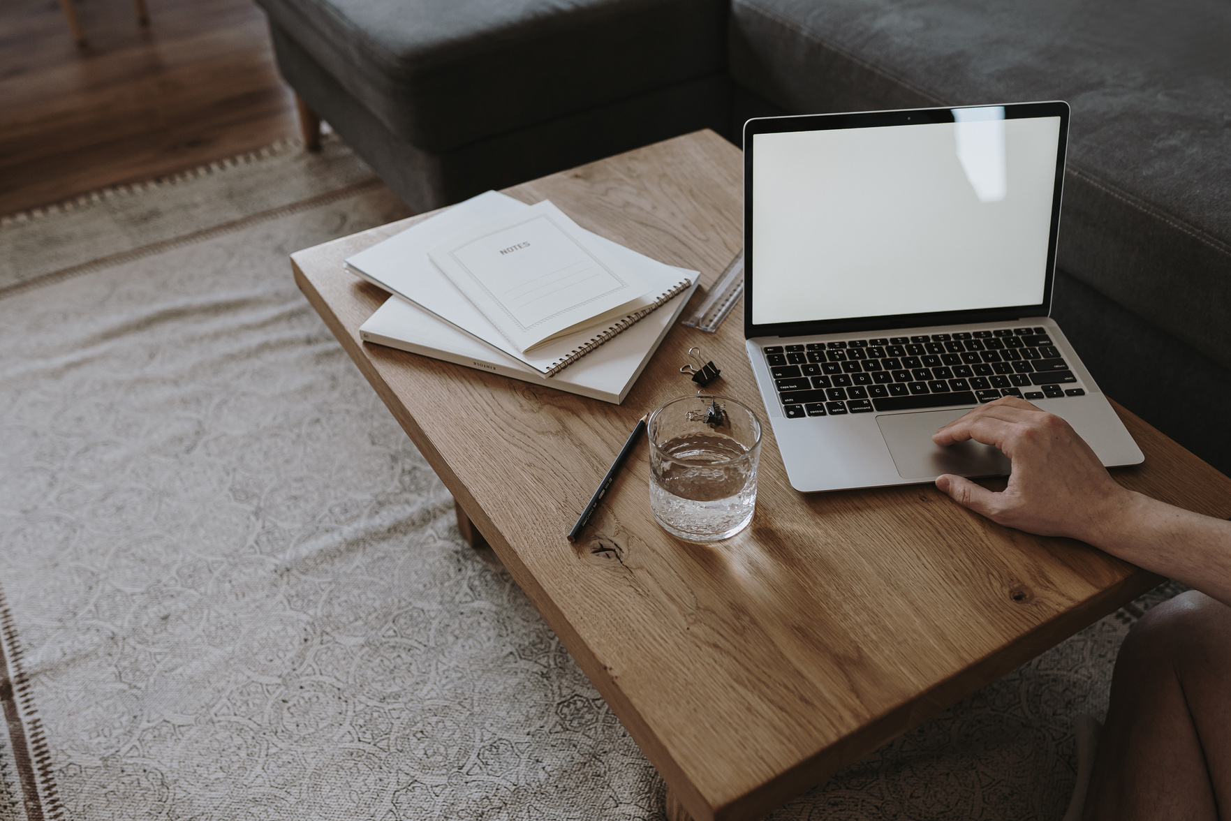 Woman Using Laptop on a Table